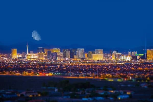 Las Vegas Strip at night with moon overhead
